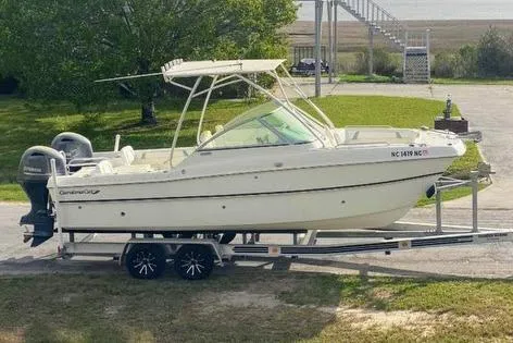 Slide: The Image of 2014 Carolina Cat 23DC boat on trailer, parked outdoors. - 31