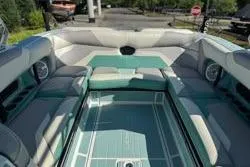 Slide: The Image of 2021 Centurion Ri245 boat interior with spacious seating and modern design. - 12