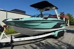 Slide: The Image of 2021 Centurion Ri245 boat with sleek design and metallic accents. - 3