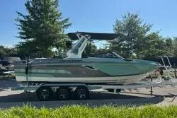 Slide: The Image of 2021 Centurion Ri245 boat rear view, showcasing sleek design and modern features. - 6