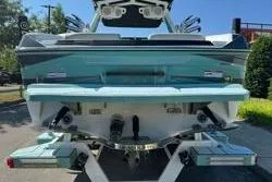 Slide: The Image of 2021 Centurion Ri245 boat interior with modern dashboard and steering wheel. - 7