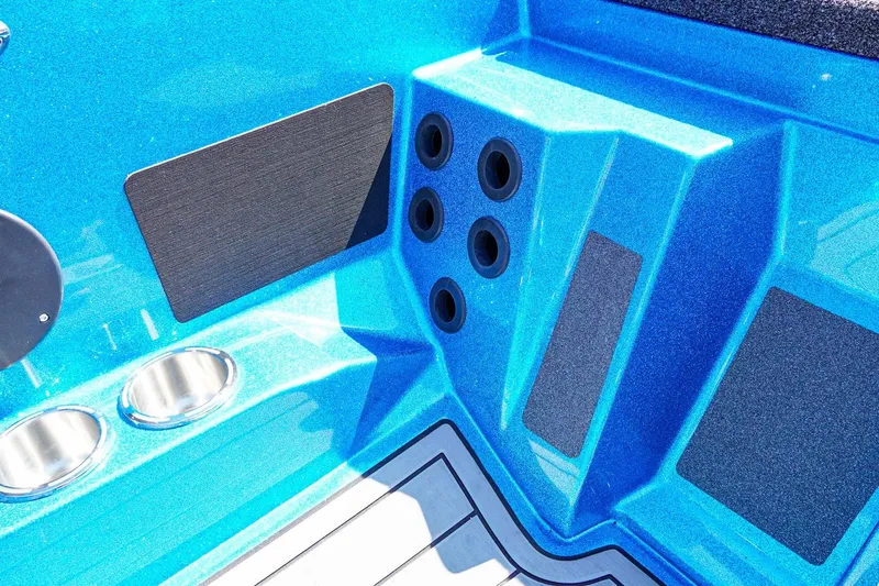 Slide: The Image of 2025 Bass Cat Puma STS interior detail with blue finish and cup holders. - 14