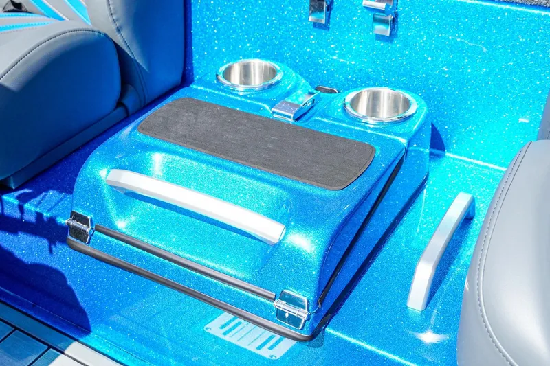 Slide: The Image of 2025 Bass Cat Puma STS interior with blue glitter finish and cup holders. - 15