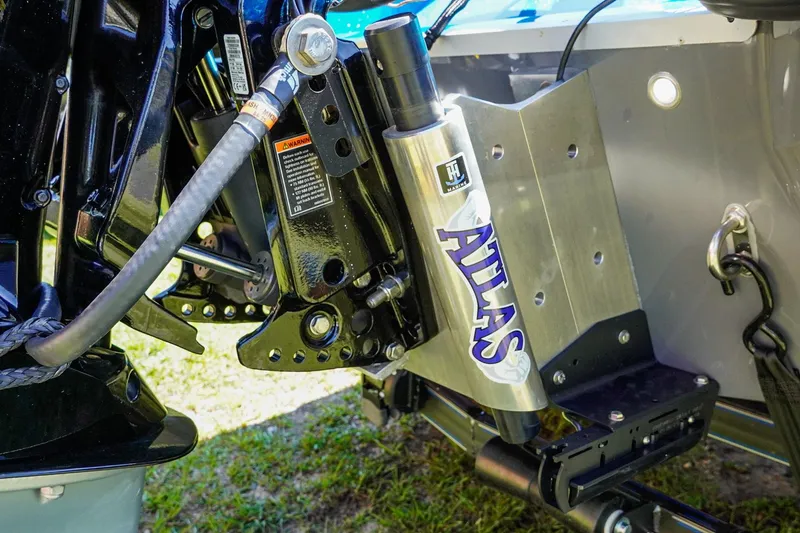 Slide: The Image of 2025 Bass Cat Puma STS boat with Atlas hydraulic jack plate detail. - 26