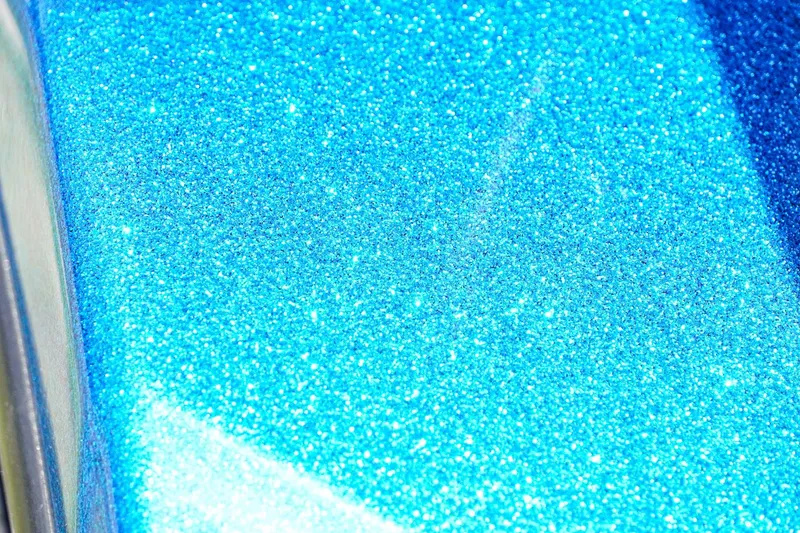 Slide: The Image of Sparkling blue metallic finish on 2025 Bass Cat Puma STS boat. - 38