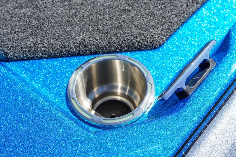 Slide: The Image of 2025 Bass Cat Puma STS boat detail with metallic blue finish and stainless steel cup holder. - 45
