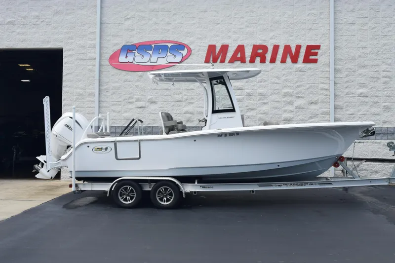 Slide: The Image of 2025 Sea Hunt Ultra 245 SE boat on trailer at GSPS Marine dealership. - 1