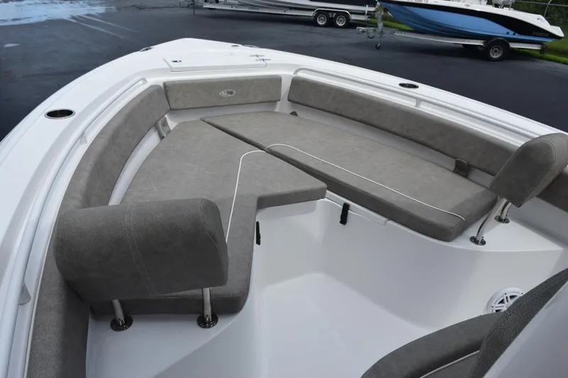 Slide: The Image of 2025 Sea Hunt Ultra 245 SE boat interior with cushioned seating. - 10
