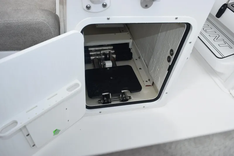 Slide: The Image of Open storage compartment on 2025 Sea Hunt Ultra 245 SE boat. - 20