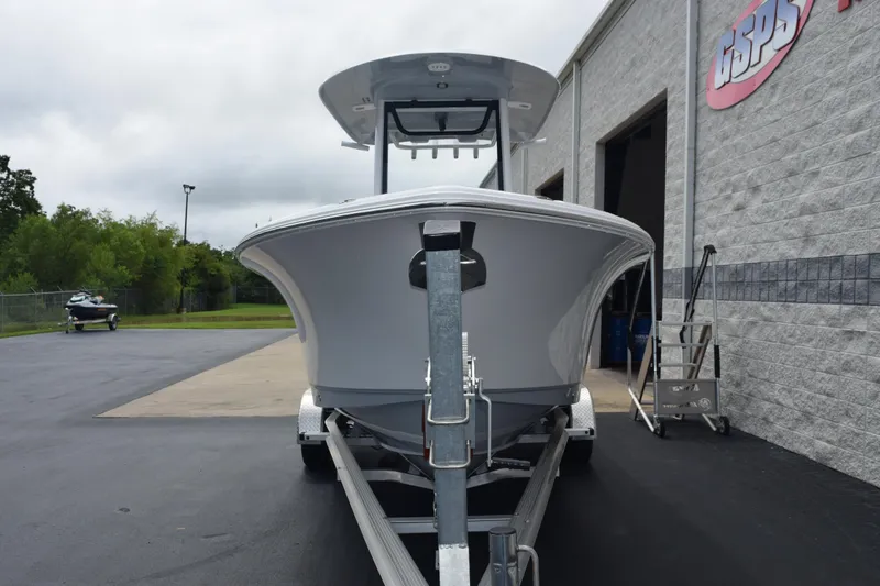 Slide: The Image of 2025 Sea Hunt Ultra 245 SE boat on trailer outside dealership. - 3
