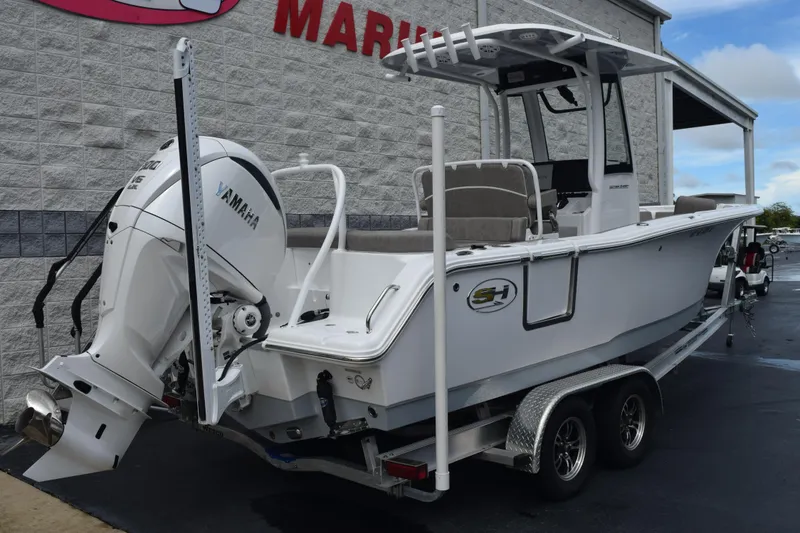 Slide: The Image of 2025 Sea Hunt Ultra 245 SE boat with Yamaha engine on trailer. - 4