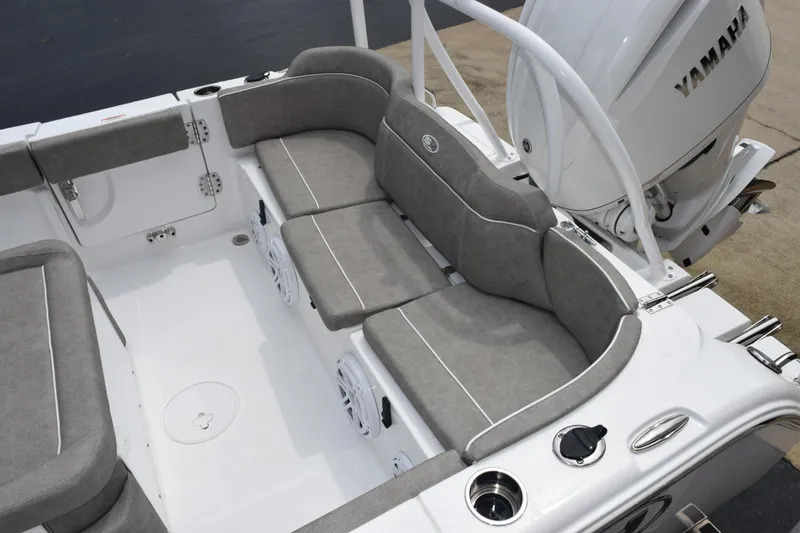 Slide: The Image of 2025 Sea Hunt Ultra 245 SE boat interior with gray cushioned seating and Yamaha engine. - 8
