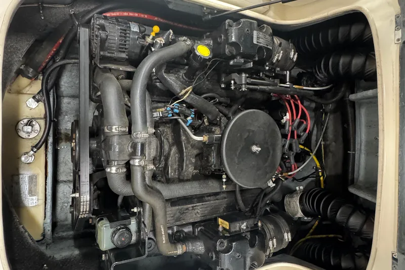 Slide: The Image of Engine compartment of a 2005 Bayliner 205 BR boat, showcasing mechanical components. - 18