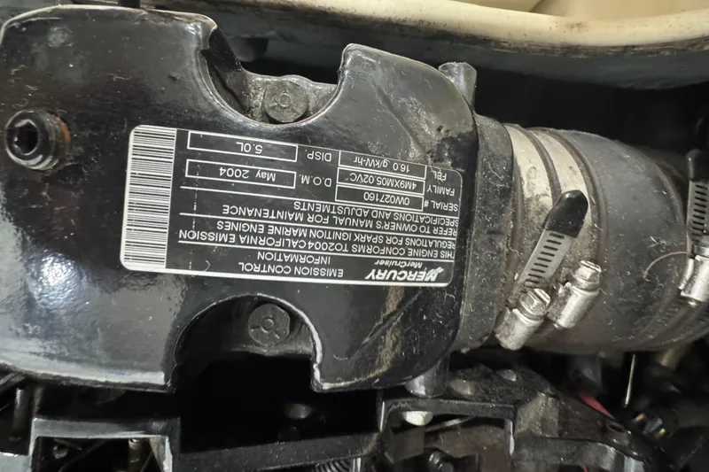 Slide: The Image of Close-up of a Mercury engine component in a 2005 Bayliner 205 BR boat. - 19