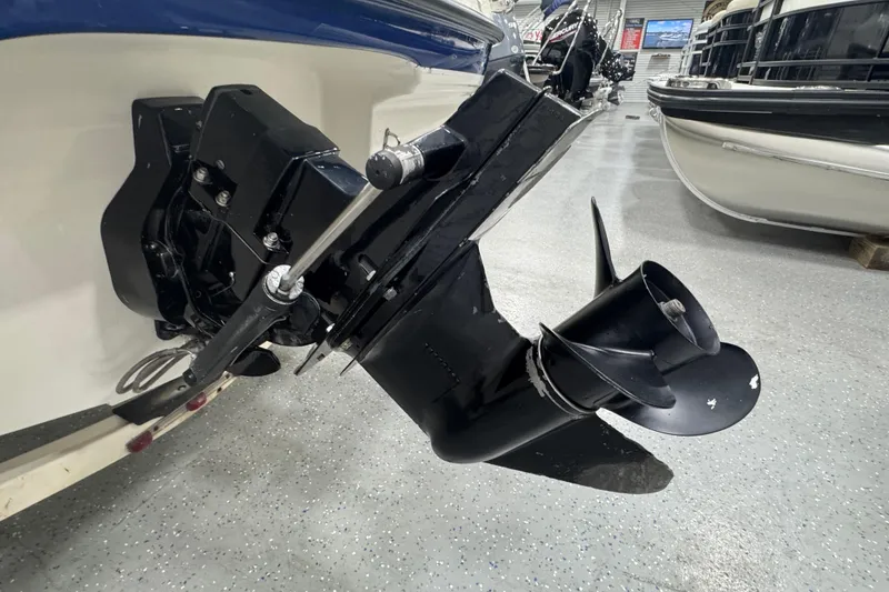 Slide: The Image of 2005 Bayliner 205 BR boat propeller and outdrive in showroom setting. - 5