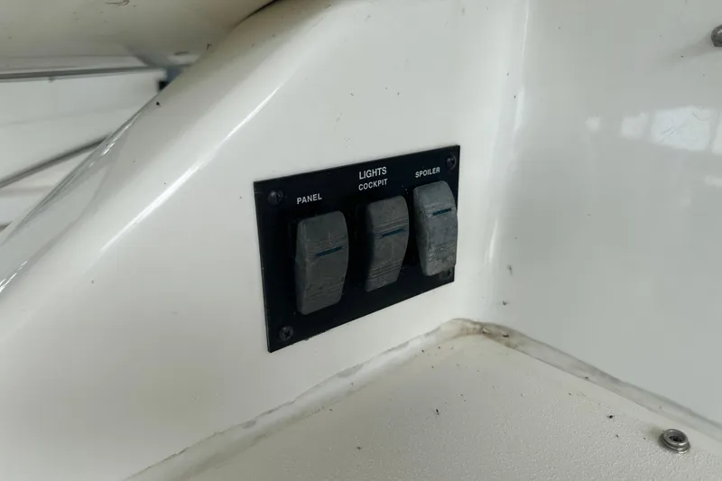 Slide: The Image of Control panel with switches on a 1995 Sea Ray 440 Express Bridge boat. - 17