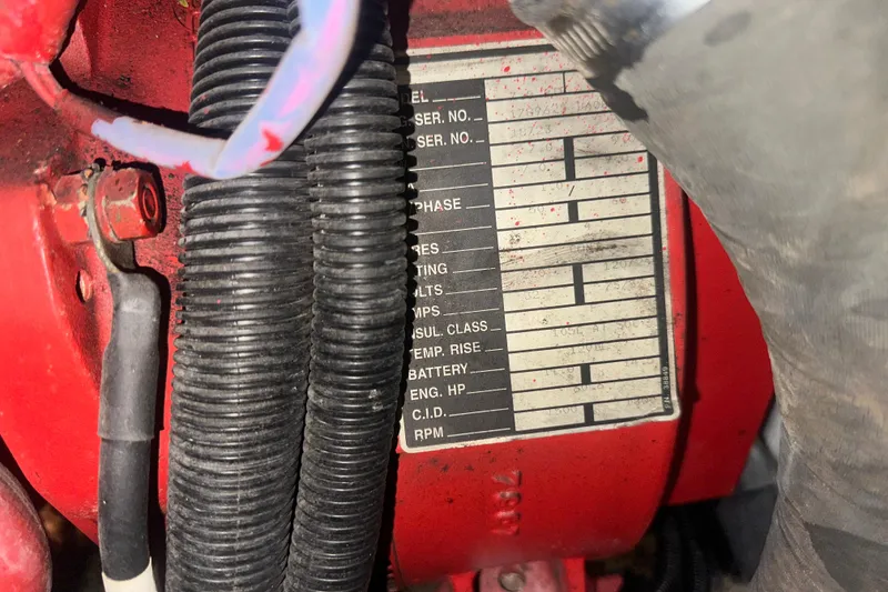 Slide: The Image of Close-up of a 1995 Sea Ray 440 Express Bridge engine label with specifications. - 54