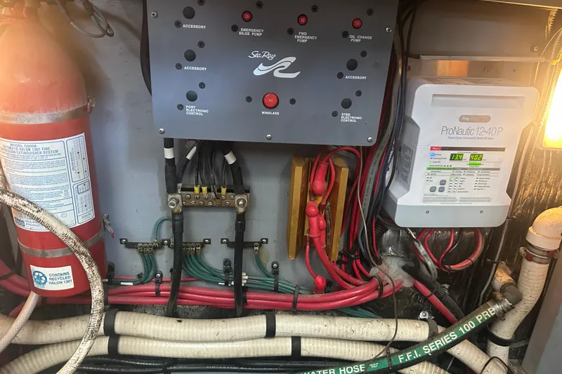 Slide: The Image of Electrical panel and fire extinguisher in 1995 Sea Ray 440 Express Bridge boat engine room. - 55