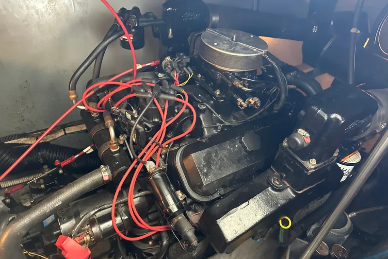 Slide: The Image of Engine of 1995 Sea Ray 440 Express Bridge with red ignition wires. - 56