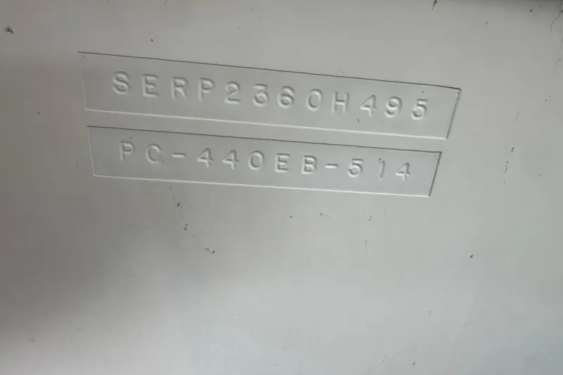Slide: The Image of 1995 Sea Ray 440 Express Bridge hull identification numbers embossed on white surface. - 59