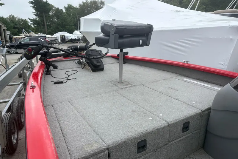 Slide: The Image of 2008 Tracker Pro Team 175 TXW boat with red trim and fishing seat. - 6