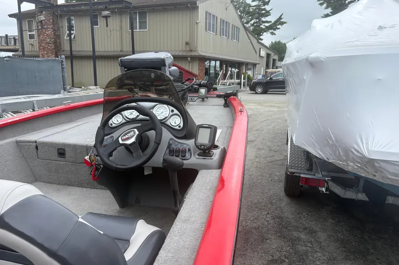 Slide: The Image of 2008 Tracker Pro Team 175 TXW boat interior with steering wheel and dashboard. - 7