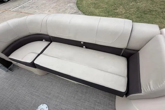 Slide: The Image of 2018 Sun Tracker SportFish 22 XP3 boat seating, beige and brown upholstery, spacious and comfortable design. - 15