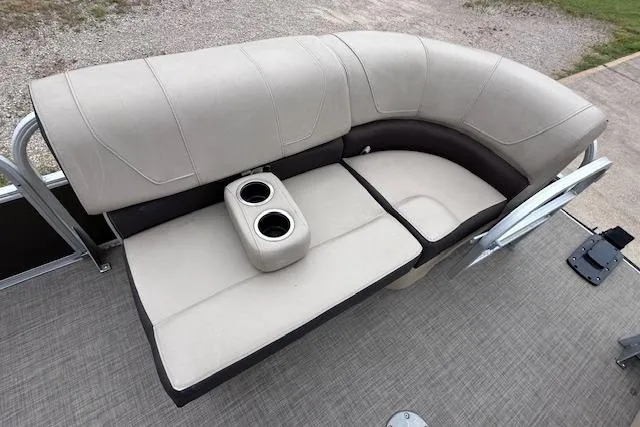 Slide: The Image of 2018 Sun Tracker SportFish 22 XP3 boat seating with cup holders, beige upholstery. - 19