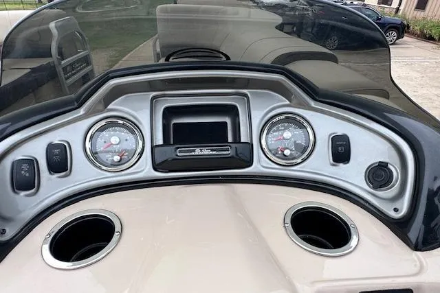 Slide: The Image of Dashboard of a 2018 Sun Tracker SportFish 22 XP3 boat with gauges and controls. - 23