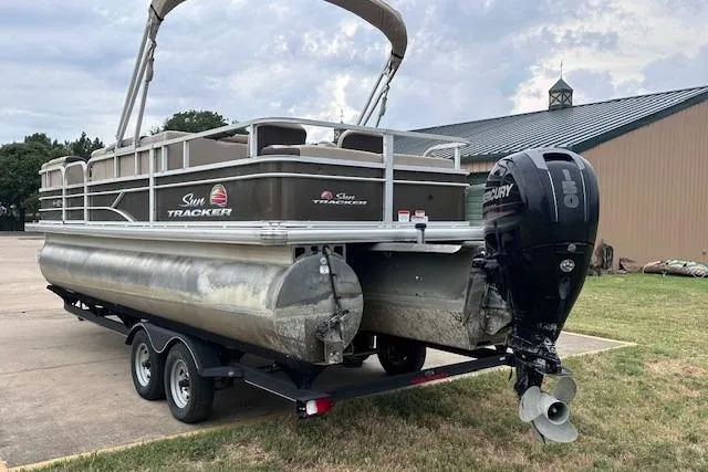 Slide: The Image of 2018 Sun Tracker SportFish 22 XP3 pontoon boat with Mercury outboard motor on trailer. - 3