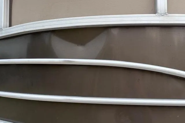 Slide: The Image of 2018 Sun Tracker SportFish 22 XP3 boat exterior with sleek metal railings. - 32