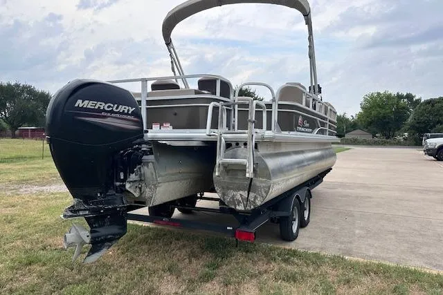 Slide: The Image of 2018 Sun Tracker SportFish 22 XP3 pontoon boat with Mercury outboard engine on trailer. - 4
