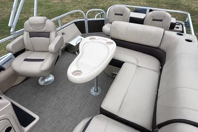 Slide: The Image of 2018 Sun Tracker SportFish 22 XP3 interior with plush seating and table. - 8