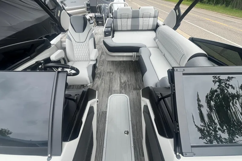 Slide: The Image of 2025 Avalon Excalibur Versatile boat interior with luxurious seating and modern design. - 11