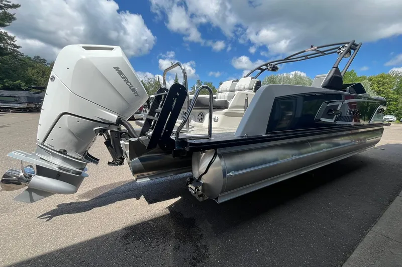 Slide: The Image of 2025 Avalon Excalibur Versatile Rear Bench Windshield boat with Mercury outboard engine. - 4