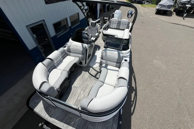 Slide: The Image of 2025 Avalon Excalibur Versatile Rear Bench Windshield boat with luxurious seating and modern design. - 8