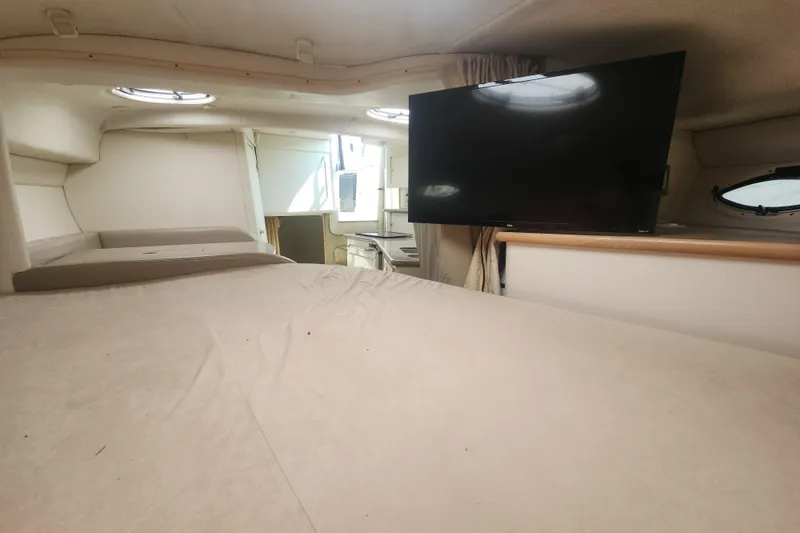 Slide: The Image of Interior of 2000 Maxum 3300 SCR yacht with bed and mounted TV. - 10