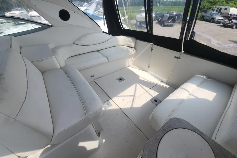Slide: The Image of Interior of 2000 Maxum 3300 SCR boat with white seating and windows. - 2