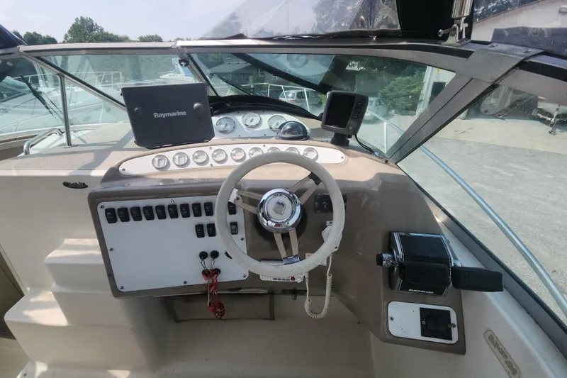 Slide: The Image of Cockpit of 2000 Maxum 3300 SCR boat with steering wheel and navigation equipment. - 3