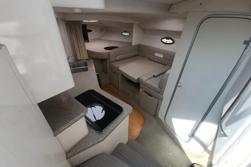 Slide: The Image of Interior of 2000 Maxum 3300 SCR boat with kitchenette and seating area. - 5