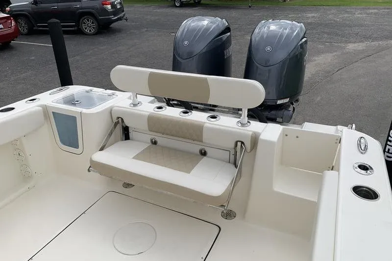 Slide: The Image of 2026 Bulls Bay 255CC boat with dual engines and foldable seating. - 10