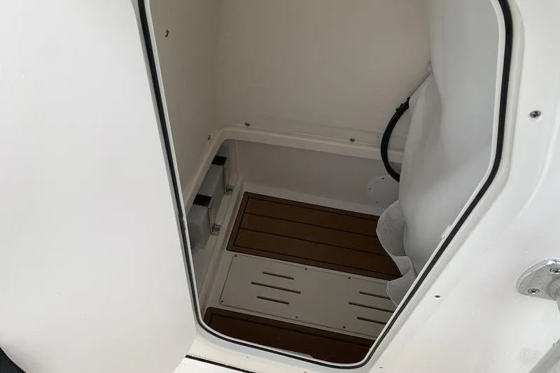Slide: The Image of 2026 Bulls Bay 255CC boat interior cabin with wooden flooring. - 25