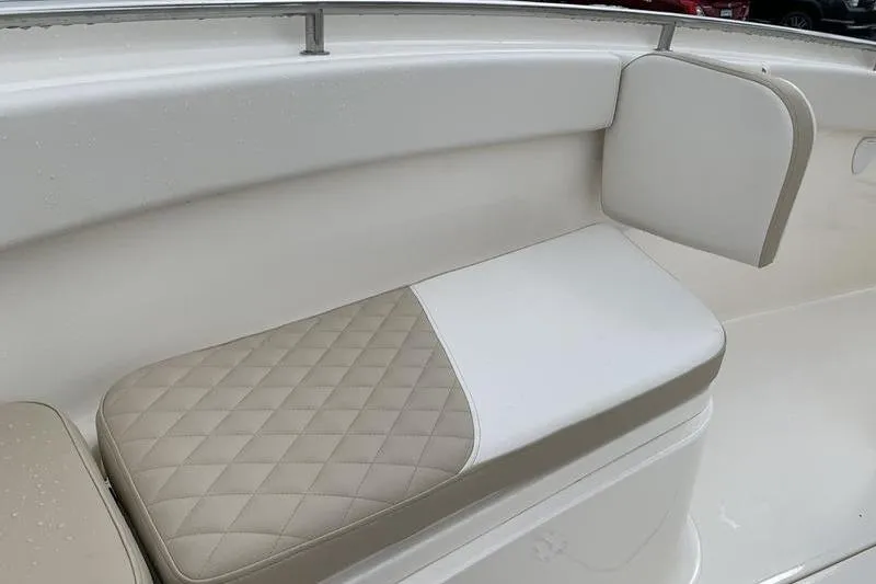 Slide: The Image of 2026 Bulls Bay 255CC boat with beige and white cushioned seating. - 30
