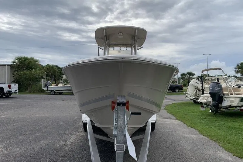 Slide: The Image of 2026 Bulls Bay 255CC boat on trailer, parked outdoors under cloudy sky. - 6