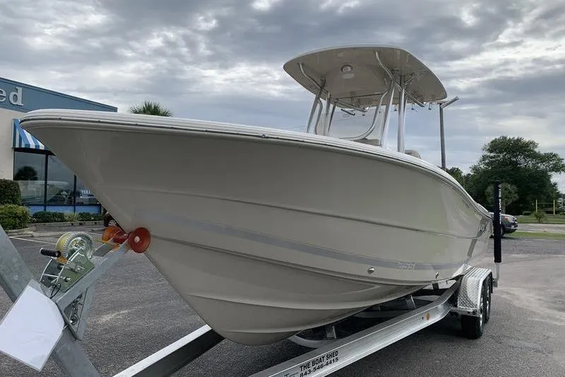 Slide: The Image of 2026 Bulls Bay 255CC boat on trailer under cloudy sky. - 7