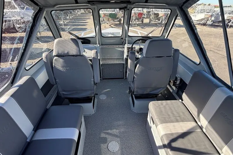 Slide: The Image of Interior of 2025 Hewescraft 190 Sea Runner ET boat, featuring spacious seating and modern design. - 4
