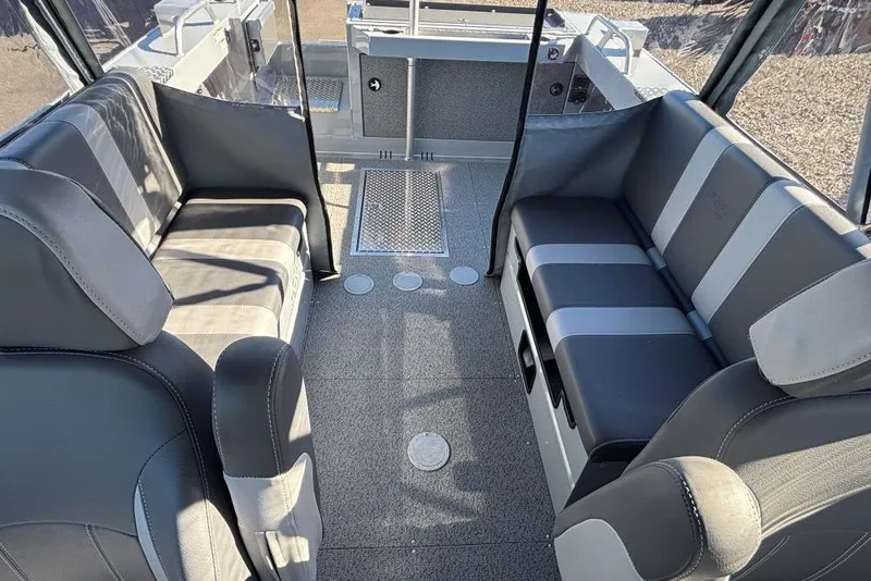 Slide: The Image of 2025 Hewescraft 190 Sea Runner ET interior with gray seating and spacious layout. - 8