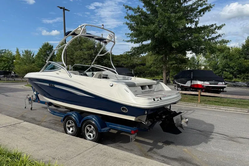 Slide: The Image of 2008 Sea Ray 230 Bow Rider Select on trailer, parked outdoors, sunny day. - 3