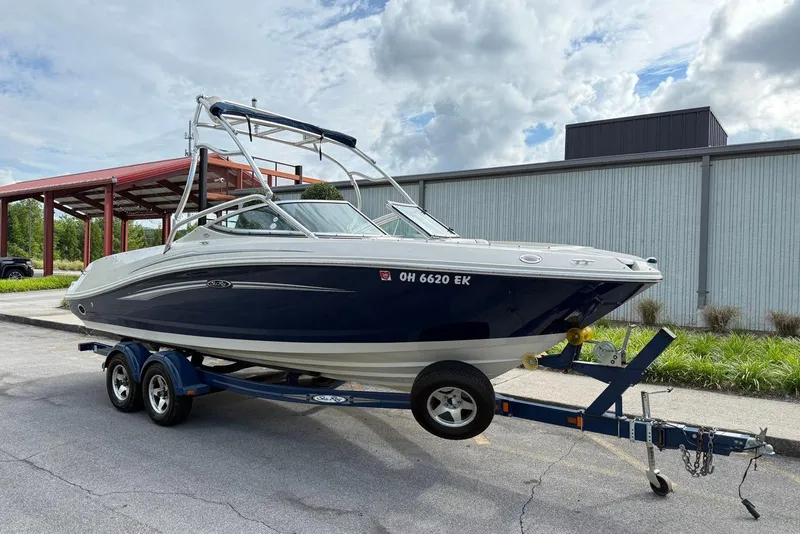 Slide: The Image of 2008 Sea Ray 230 Bow Rider Select on trailer, parked outdoors. - 5