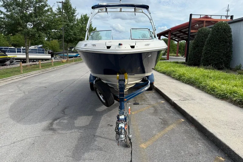 Slide: The Image of 2008 Sea Ray 230 Bow Rider Select on trailer, parked outdoors. - 6